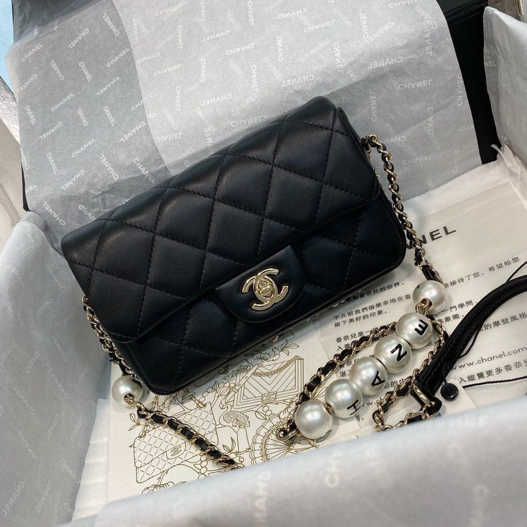 Chanel Pearl Logo Strap Flap Bag Black — view 1