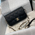 Chanel Pearl Logo Strap Flap Bag Black — view 1