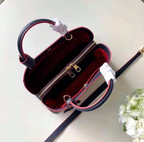 LV Montaigne MM Monogram Empreinte Leather Handle Shoulder Bag with Navy Blue Leather Trim and Shoulder Strap — view 4
