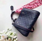 LV Montaigne MM Monogram Empreinte Leather Handle Shoulder Bag with Navy Blue Leather Trim and Shoulder Strap — view 2