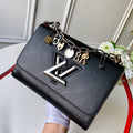 LV Twist MM Epi Leather Handle Crossbody Bag with LV Twist Lock and Love Lock Charms — view 1