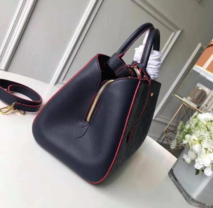 LV Montaigne MM Monogram Empreinte Leather Handle Shoulder Bag with Navy Blue Leather Trim and Shoulder Strap — view 3