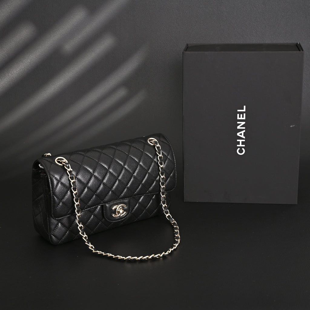 Chanel Classic Flap Bag – Black Quilted Caviar Leather with Gold-Tone Hardware — view 1