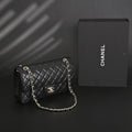 Chanel Classic Flap Bag – Black Quilted Caviar Leather with Gold-Tone Hardware — view 1