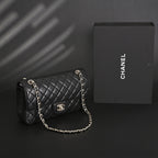 Chanel Classic Flap Bag – Black Quilted Caviar Leather with Gold-Tone Hardware — view 1