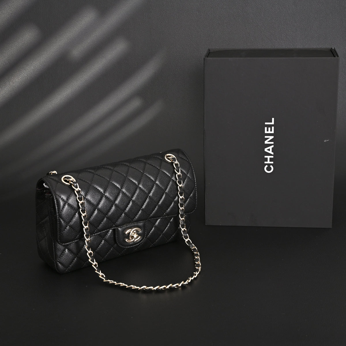 Chanel Classic Flap Bag – Black Quilted Caviar Leather with Gold-Tone Hardware — view 1