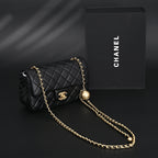 Chanel Classic Flap Mini Bag – Black Quilted Lambskin with Gold-Tone Hardware — view 1