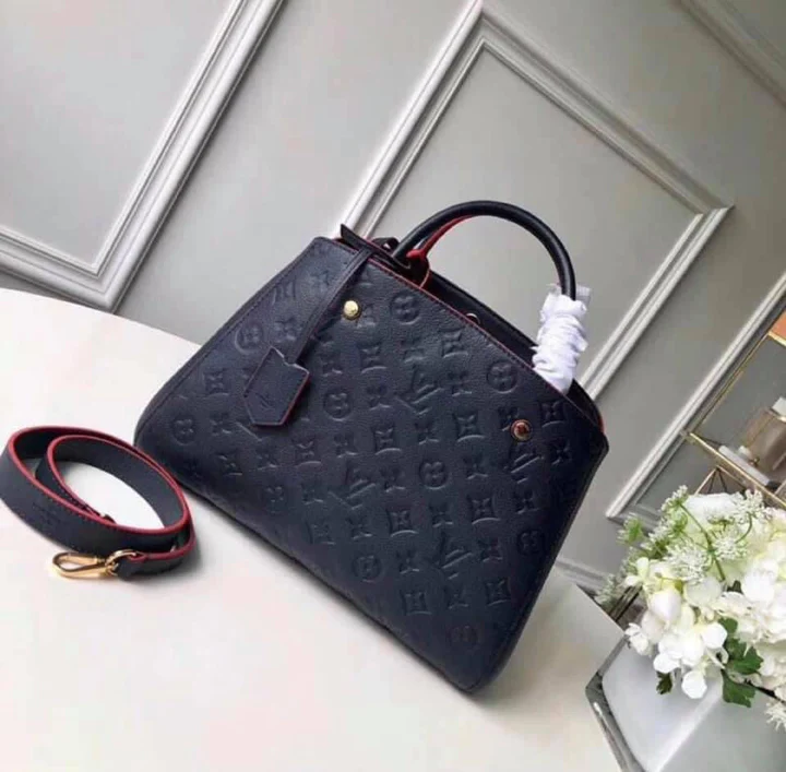 LV Montaigne MM Monogram Empreinte Leather Handle Shoulder Bag with Navy Blue Leather Trim and Shoulder Strap — view 1