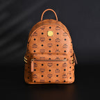 Mcm Stark Visetos Medium Backpack – Cognac Monogram with Gold-Tone Studs - Cognac with Black Monogram Print — view 1